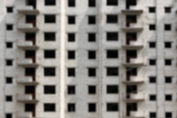 Blurred view of unfinished building as background