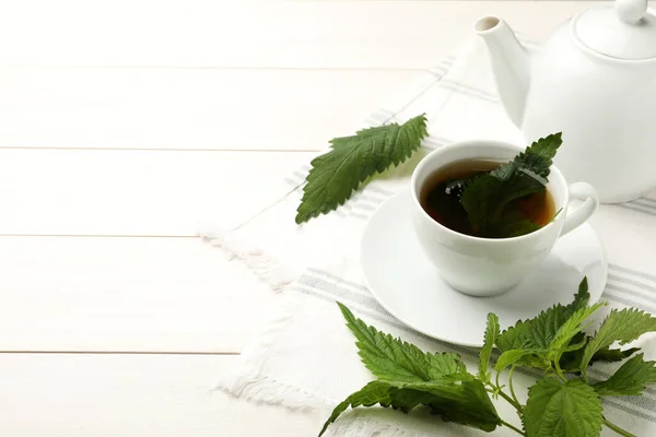 Aromatic Nettle Tea Green Leaves White Wooden Table Space Text — Stock Photo, Image
