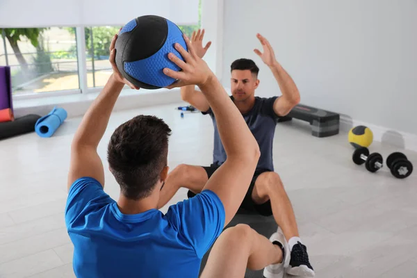 Muscular Men Exercising Medicine Ball Modern Gym — 图库照片