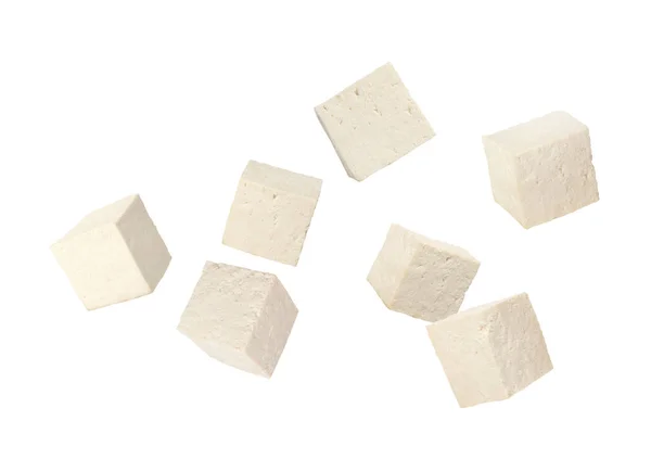 生豆腐的立方体落在白色的背景上 — 图库照片