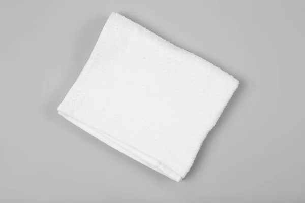 Folded White Beach Towel Light Grey Background Top View — Stock Photo, Image