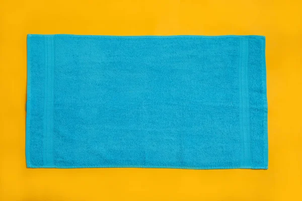Light Blue Beach Towel Yellow Background Top View — Stock Photo, Image