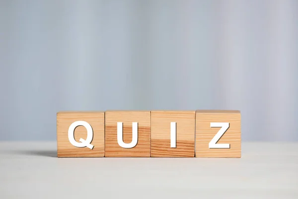 Wooden Cubes Word Quiz White Table Space Text — Stock Photo, Image