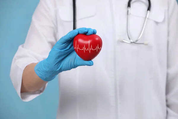 Doctor Holding Red Heart Light Blue Background Closeup — Stock Photo, Image