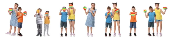 Enfants Mignons Avec Pop Fidget Jouets Sur Fond Blanc Collage — Photo
