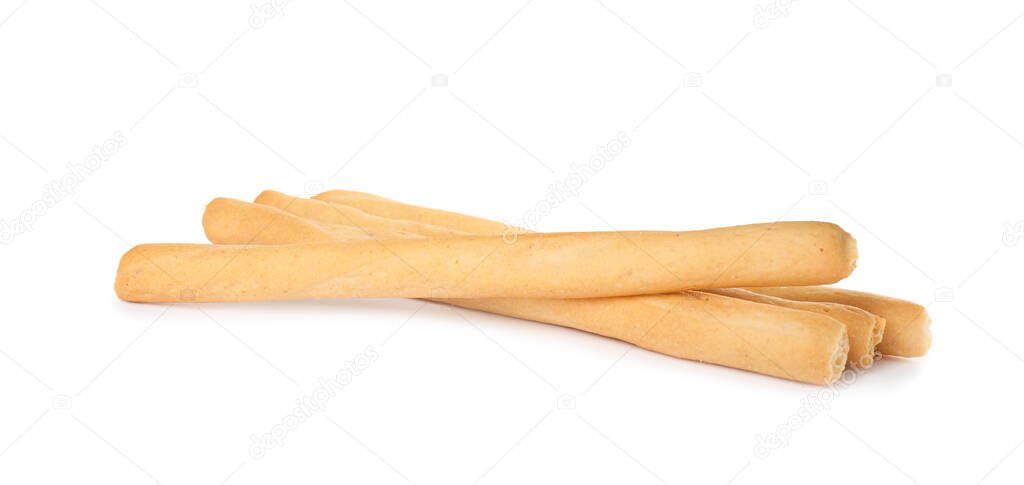 Fresh delicious grissini sticks on white background