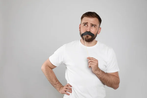 Thoughtful Man Fake Mustache Light Grey Background Space Text — Stock Photo, Image
