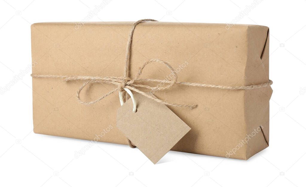 Parcel wrapped with kraft paper, twine and tag isolated on white