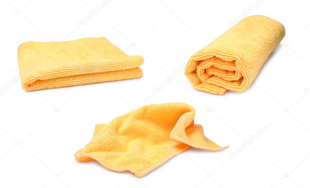 Set with yellow microfiber cloths on white background