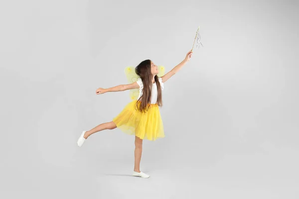 Cute Little Girl Fairy Costume Yellow Wings Magic Wand Light — Stock Photo, Image