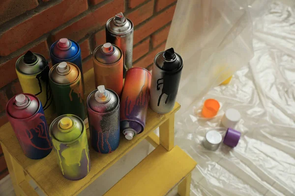 Used Cans Spray Paints Stand Brick Wall Indoors Graffiti Supplies — Stock Photo, Image