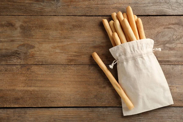 Deliciosos Palos Grissini Bolsa Mesa Madera Puesta Plana Espacio Para —  Fotos de Stock