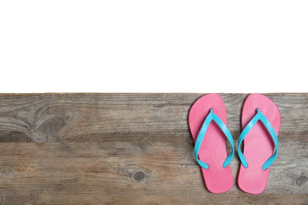 Pair Pink Flip Flops Space Text Wooden Table White Background — Stock Photo, Image