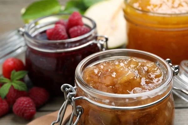 Jars Different Jams Fresh Berries Wooden Table Closeup — Stock Photo, Image