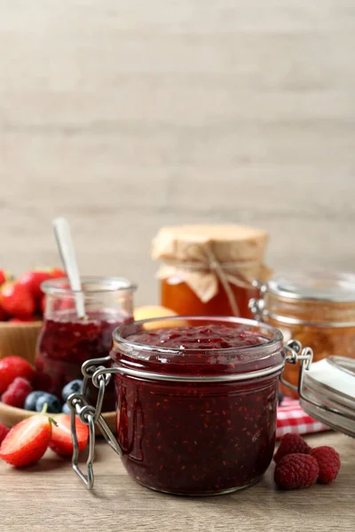 Jars Different Jams Fresh Berries Wooden Table — Stock Photo, Image