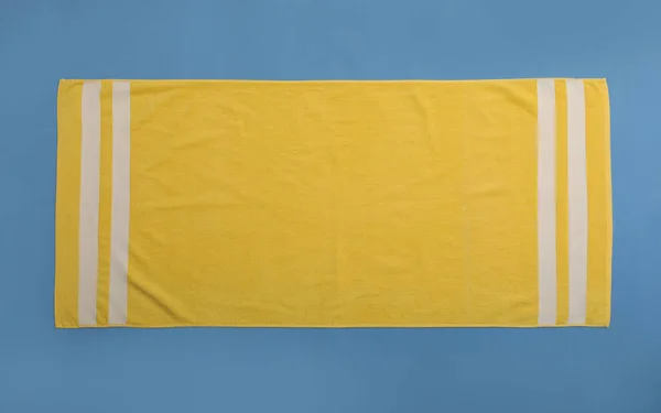 Yellow Beach Towel Blue Background Top View — Stock Photo, Image