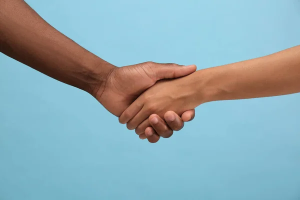 Woman African American Man Shaking Hands Light Blue Background Closeup — Stock Photo, Image
