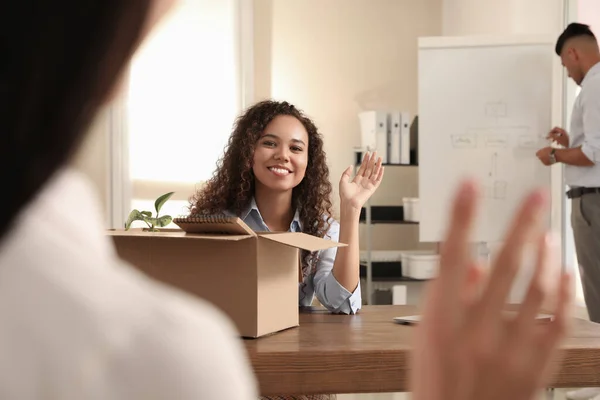 Employee greeting new coworker in modern office