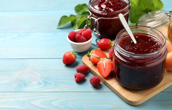 Jars Different Jams Fresh Berries Light Blue Wooden Table Space — Stock Photo, Image