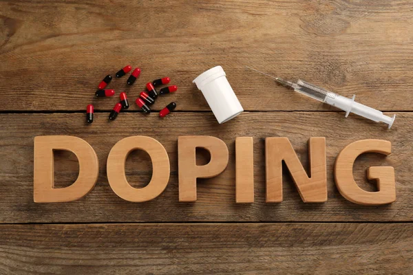 Sözcük Doping Uyuşturucu Tahta Arka Planda Düz Yatıyordu — Stok fotoğraf