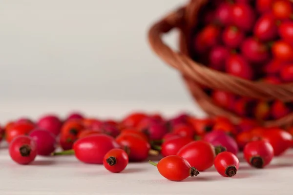 Ripe Rose Hip Berries Wicker Basket White Wooden Table Closeup — Stock Photo, Image