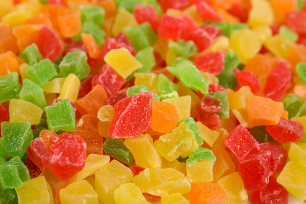 Mix of delicious candied fruits as background, closeup