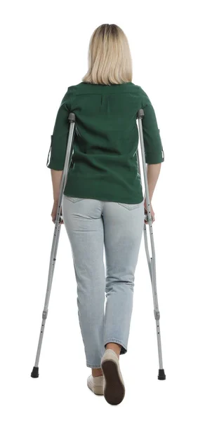 Woman Crutches White Background Back View — Stock Photo, Image