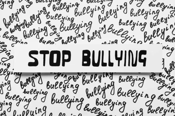 Композиция Текстом Stop Bullying Белом Фоне Вид Сверху — стоковое фото