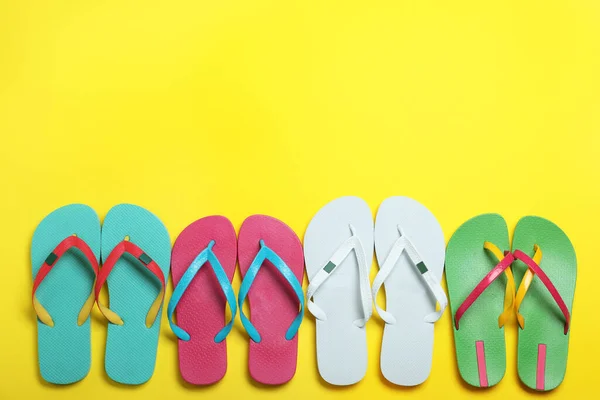 Many Different Stylish Flip Flops Yellow Background Flat Lay Space — Stock Photo, Image