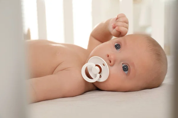 Cute Little Baby Pacifier Lying Crib — Stock Photo, Image