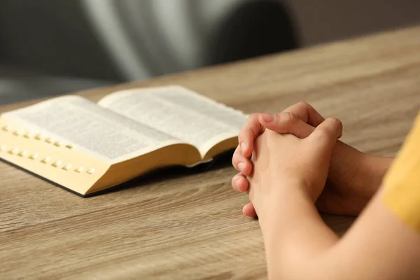 Religious Woman Praying Bible Wooden Table Indoors Closeup — Stock Photo, Image