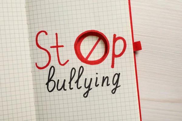 Cuaderno Abierto Con Frase Stop Bullying Mesa Madera Blanca Vista — Foto de Stock