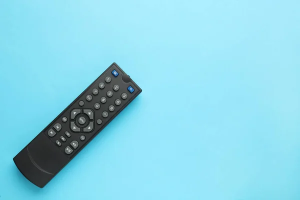 Remote Control Light Blue Background Top View Space Text — Stock Photo, Image