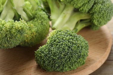 Fresh raw broccoli on table , closeup view