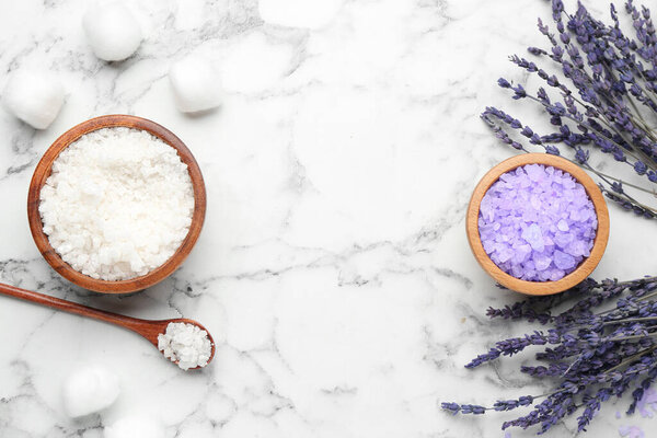 Sea salt and lavender on white marble table, flat lay. Space for text
