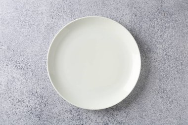 One stylish plate on grey table, top view