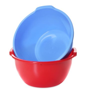 Two colorful plastic basins isolated on white