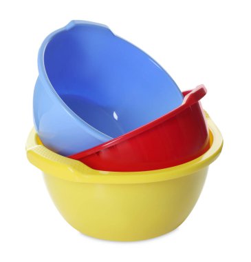 Three colorful plastic basins isolated on white