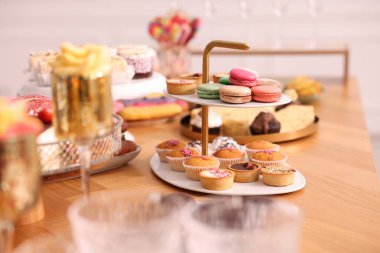 Buffet menu. Different delicious desserts on table, selective focus