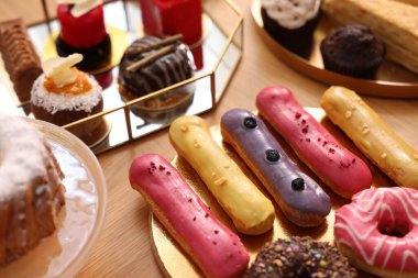 Buffet menu. Different delicious desserts on table, selective focus