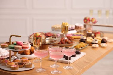Buffet menu. Delicious desserts and drinks on table, selective focus