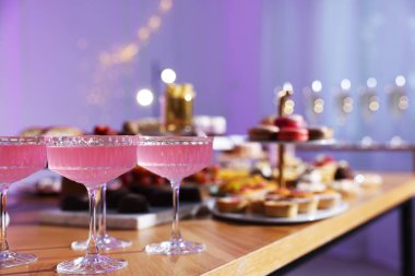 Buffet menu. Delicious desserts and drinks on table, selective focus