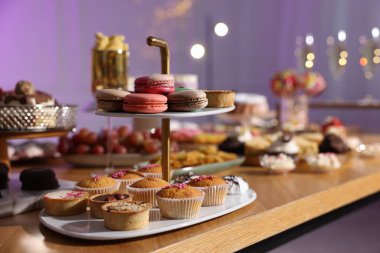 Buffet menu. Different delicious desserts on table, selective focus