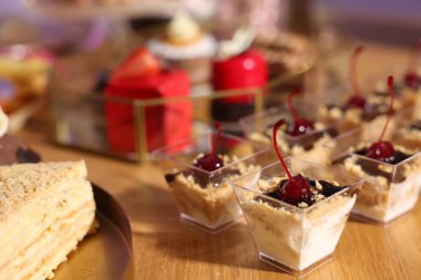 Buffet menu. Different delicious desserts on table, selective focus
