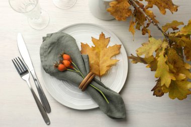 Beautiful table setting with autumn decor on white wooden background, flat lay