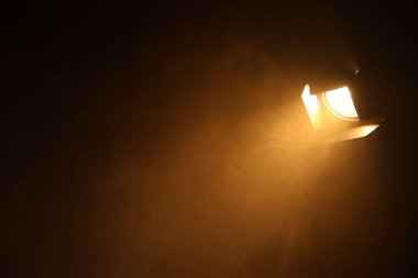Professional lighting equipment without reflector and smoke on dark background. Space for text