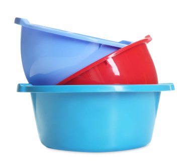 Three colorful plastic basins isolated on white