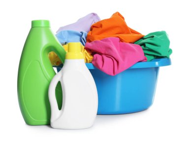 Plastic basin with laundry and detergents isolated on white