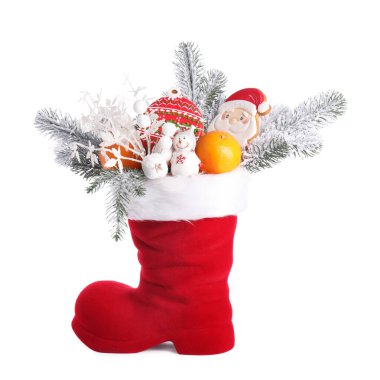 Saint Nicholas day. Red boot with treats and festive decor isolated on white