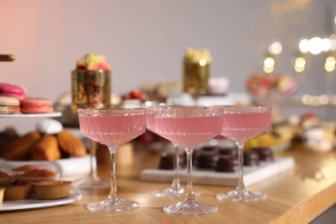 Buffet menu. Delicious desserts and drinks on table, selective focus